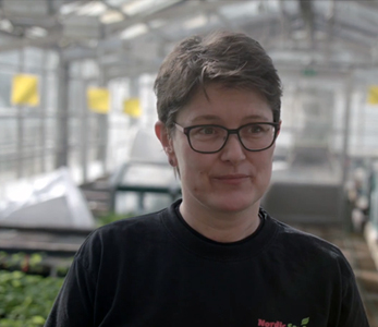 Video screenshot of employee at Nordic Seed talking about how they're using TAGARNOs digital microscopes