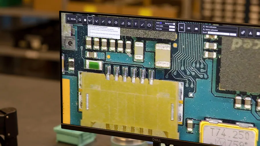 Monitor displaying a magnified PCB