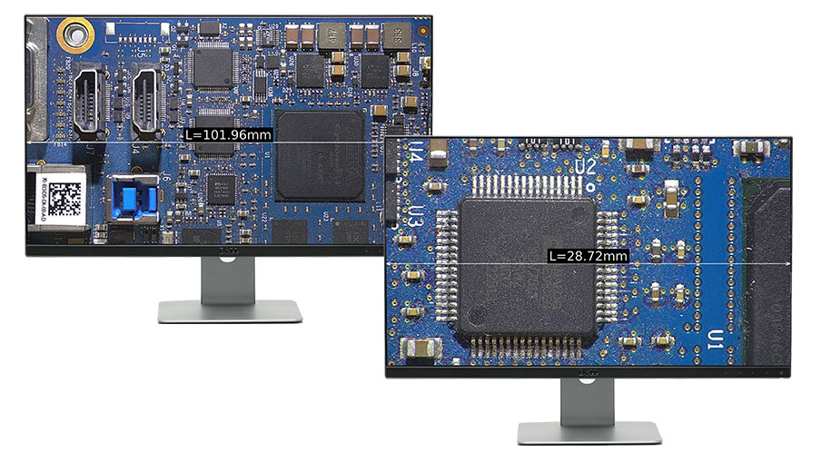 Two monitors, each showing a PCBA at different magnification levels with different field of views.
