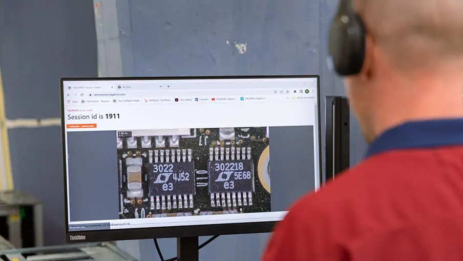 Man sharing digital camera microscope feed in online meeting to collaborate with remote colleagues